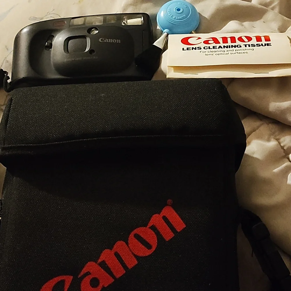 Vintage Canon camera and Canon bag with brush cleaner